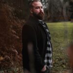 Portrait Of A Bearded Man In Nature In Autumn